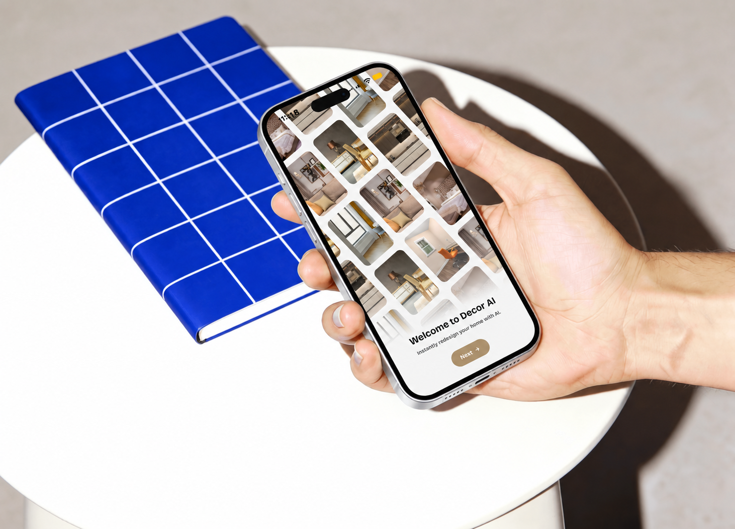 Ai_Decor onboarding on an iPhone held above a white table