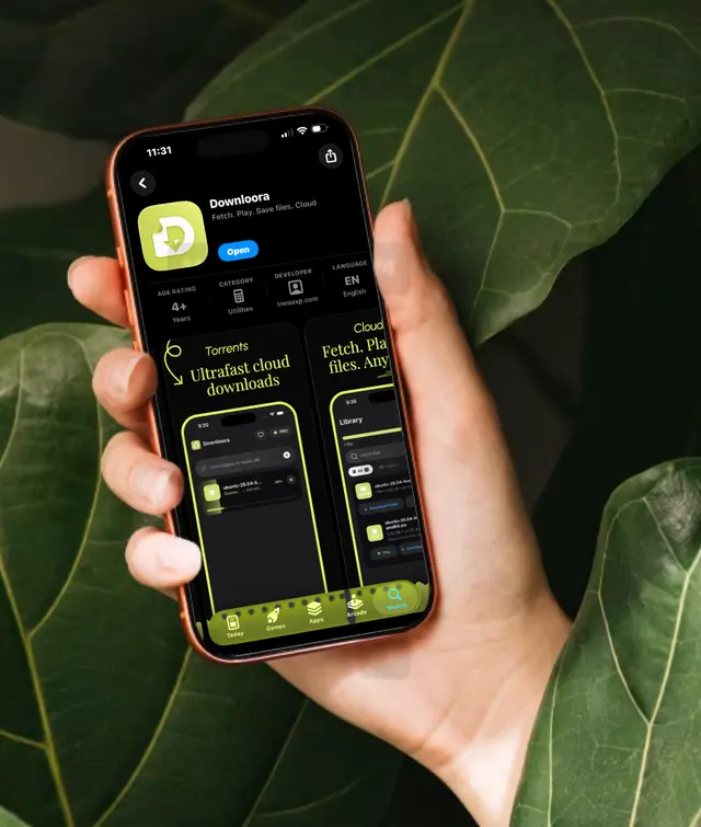 Downloora on an iPhone held against green leaves